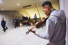 Musician Raycurt Johnson plays for the commuters at D.C.'s Metro station at L'Enfant Plaza. (Photo: Jeff Watts)